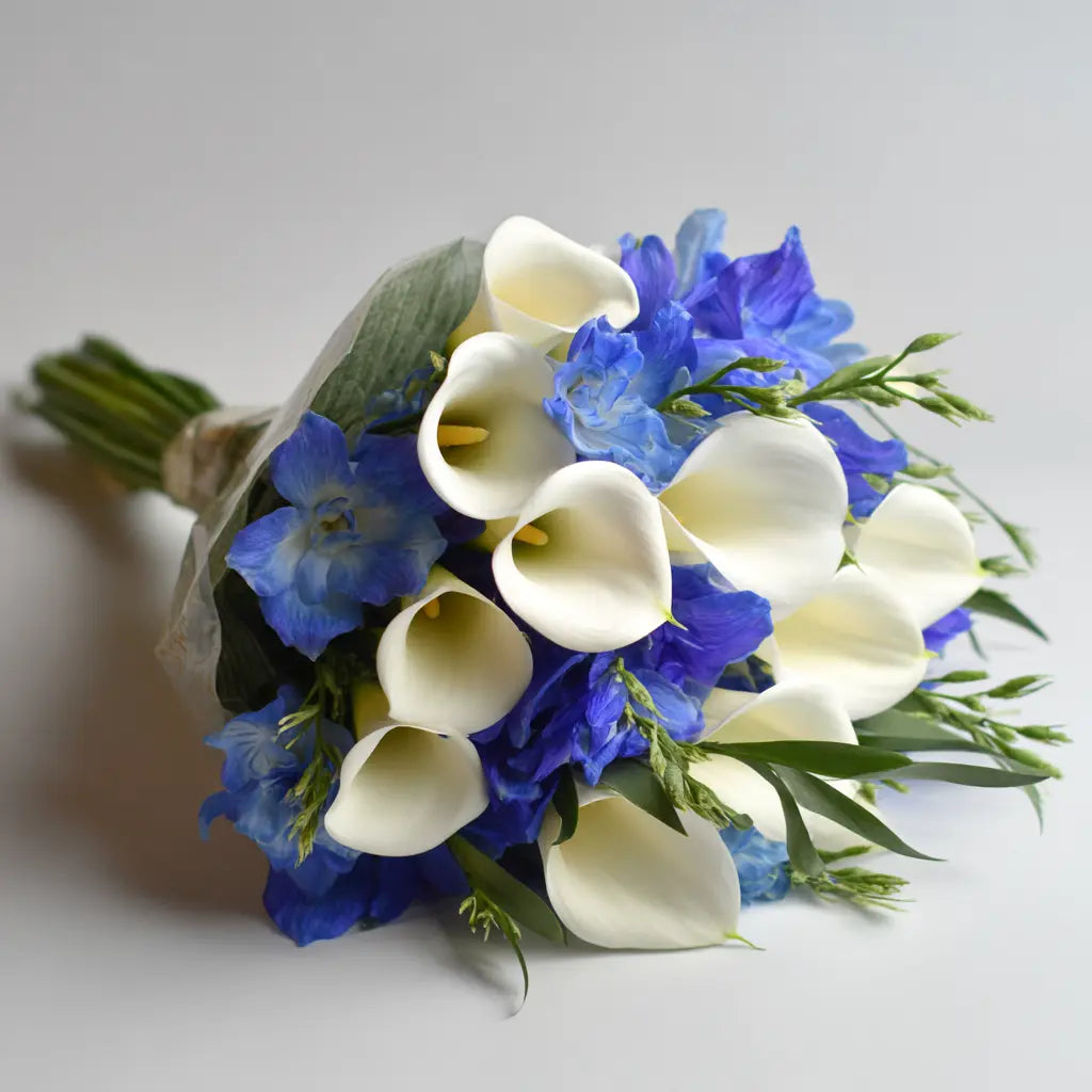 White Calla Lilies with Blue Bouquet Send Blooms